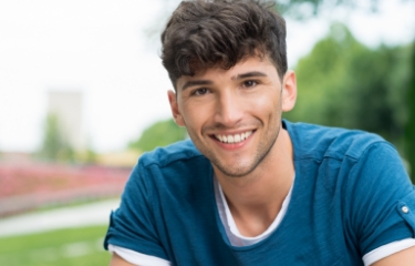 Young man with straight smile after Invisalign orthodontic treatment