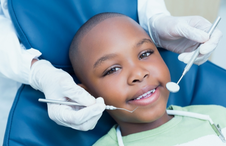 Child receiving dental treatment