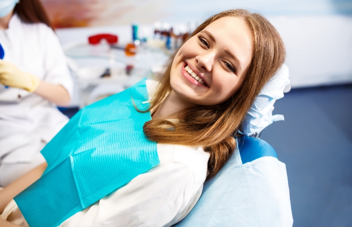 Woman smiling thanks to comprehensive dentistry