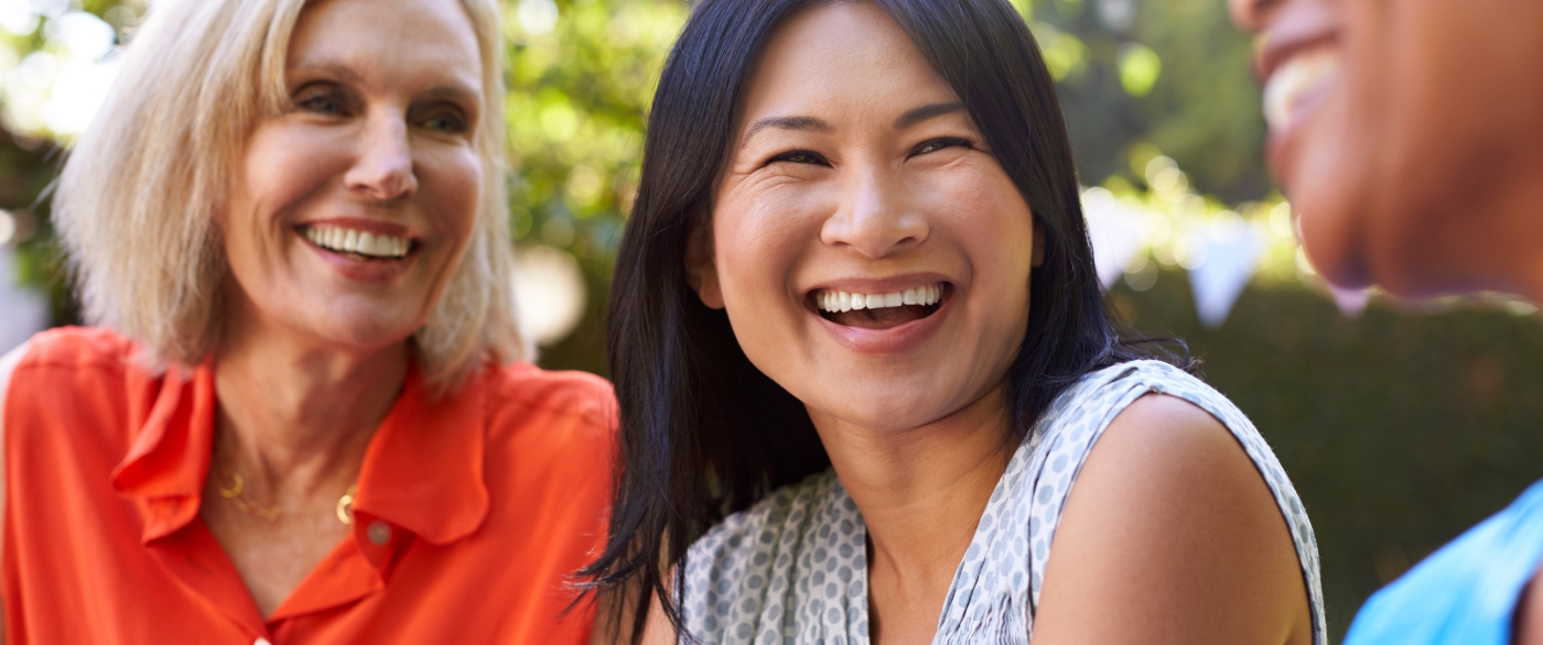 Friends with dental bridges smiling together