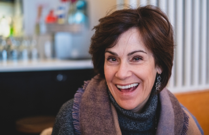 Smiling woman with dental bridge restoration