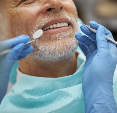 Man receiving a dental exam