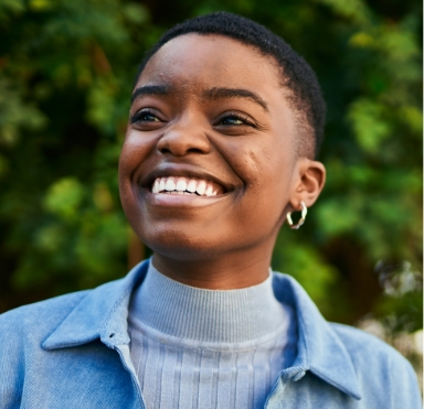 Smiling woman enjoying the benefits of dental implants