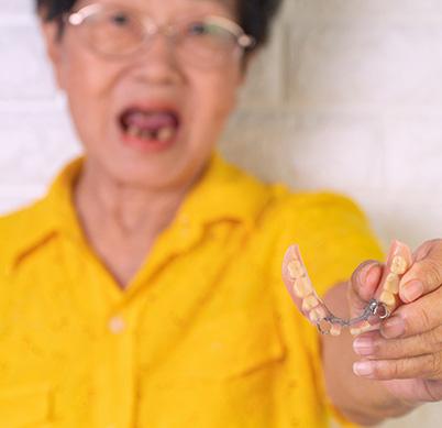 Patient with dentures in Denton