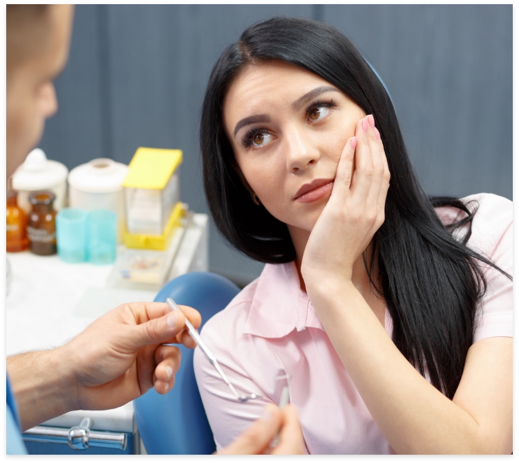 woman in pain before emergency dentistry