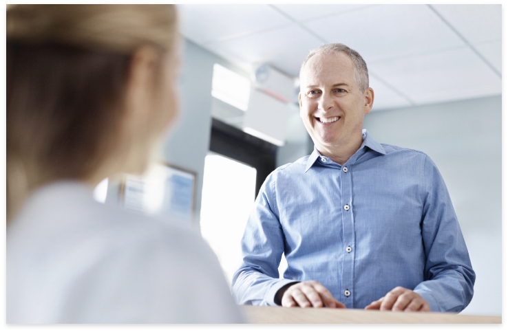 Man discussing financial options for emergency dentistry