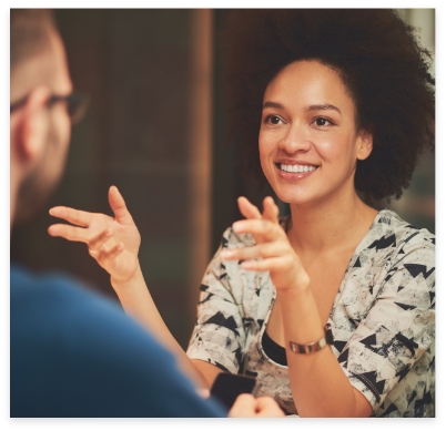 Woman talking to cosmetic dentist about cosmetic dentistry options