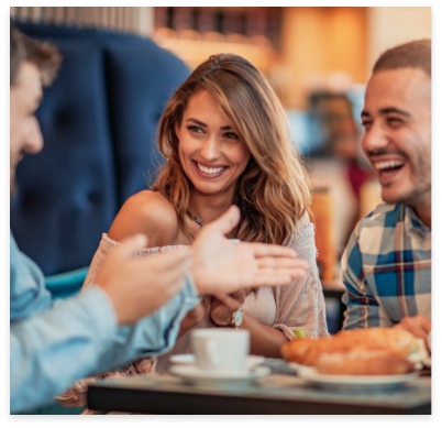 Woman sharing beautiful new smile with friends