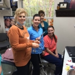 Smiling dental team members in dentistry treatment room