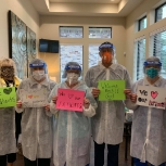 Dental team members wearing protective clothing