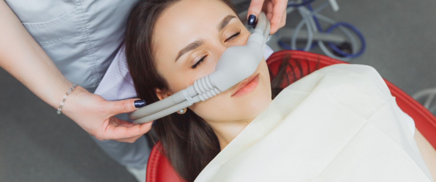 Resting dental patient receiving nitrous oxide sedation dentistry