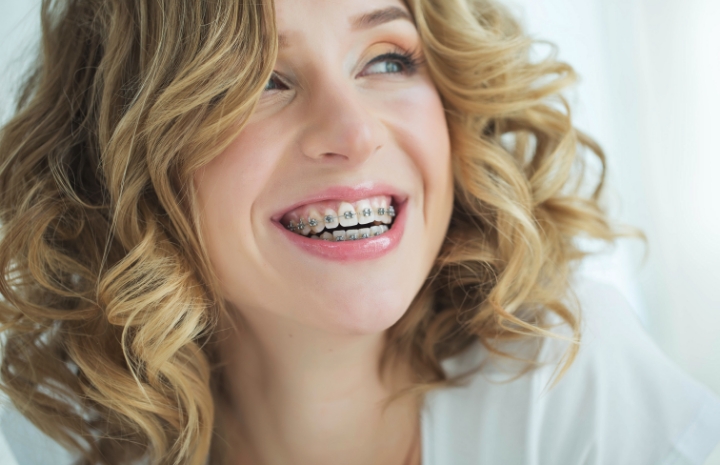 Woman with braces smiling