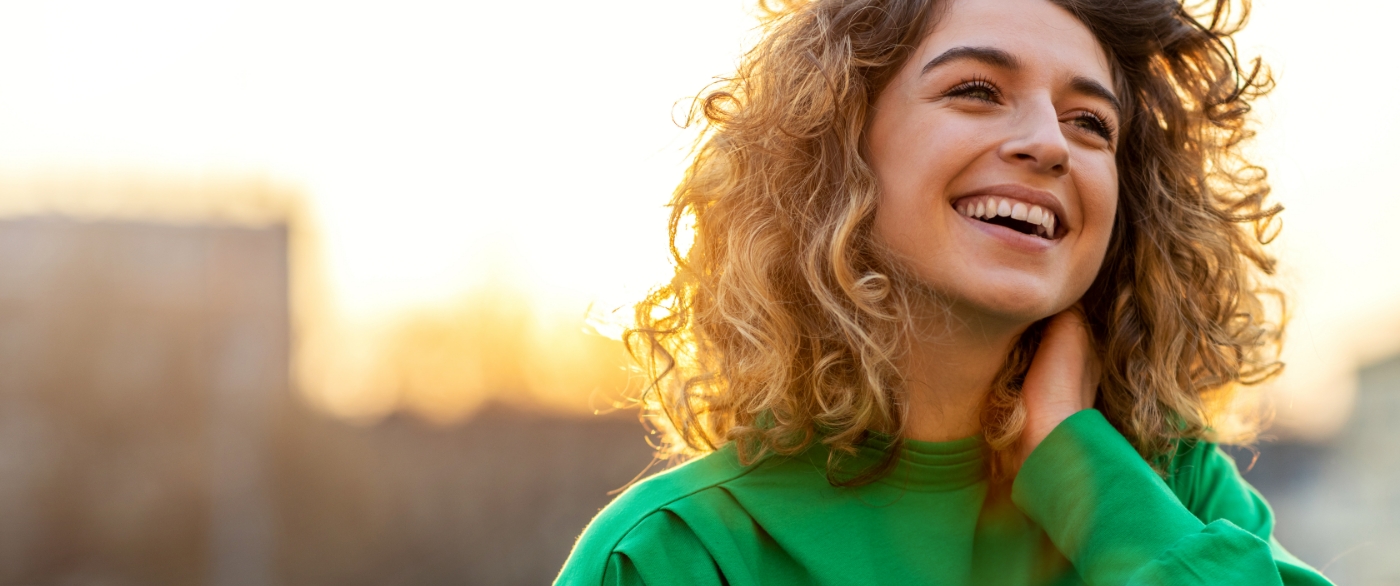 Woman with healthy smile thanks to preventive dentistry