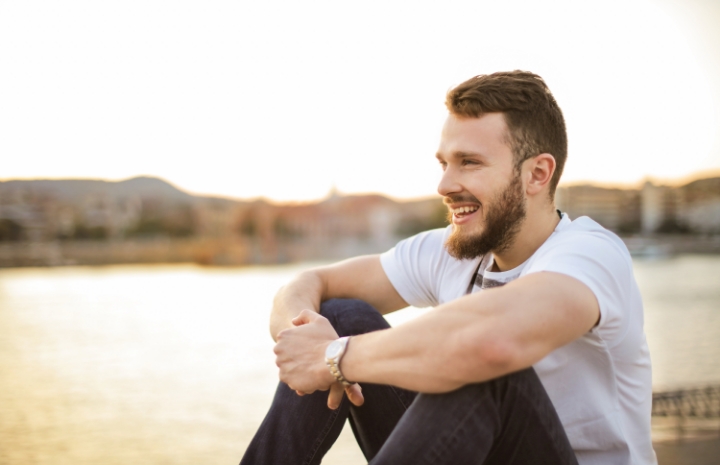 Man smiling after dental checkups and teeth cleanings