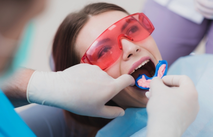 Dental patient receiving fluoride treatment