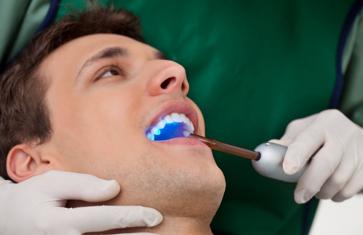 Man receiving dental sealants