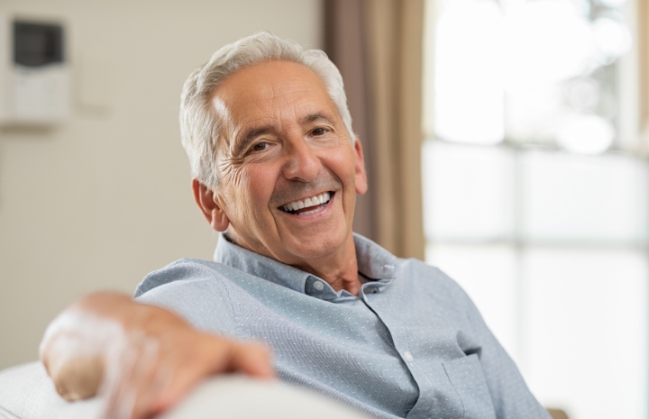 Man smiling after tooth colored filling dental restoration