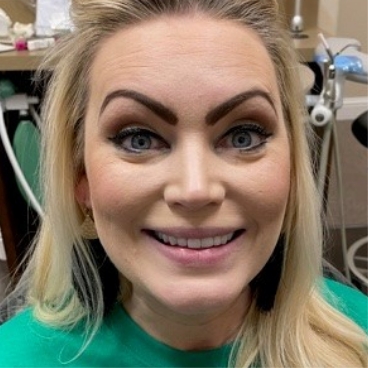 Woman smiling after dental treatment