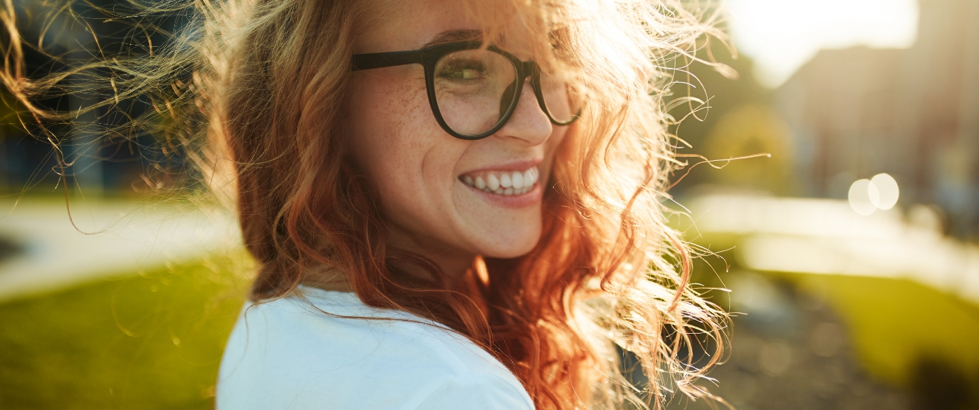 Woman with veneers sharing flawless smile