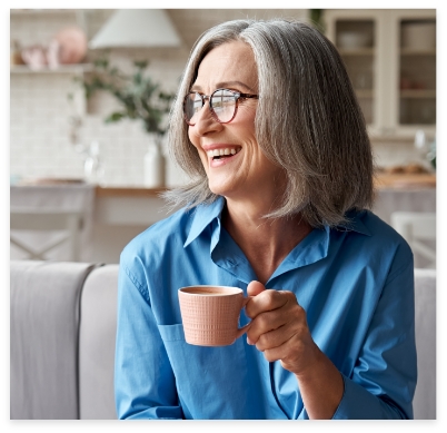 Older woman smiling after cosmetic dentistry