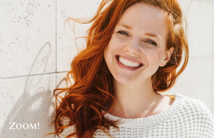 Woman with red hair smiling after Zoom2! Teeth Whitening