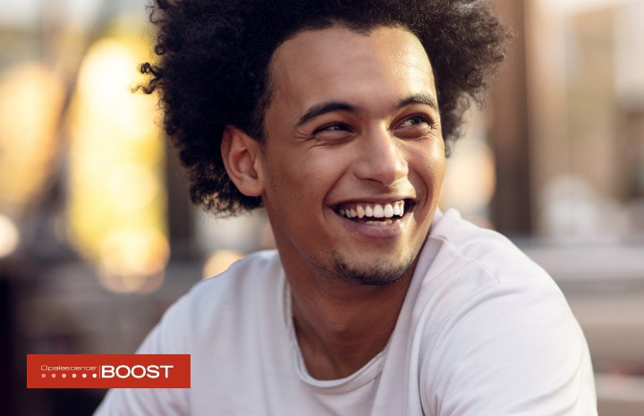 Young man pleased with his smile after BOOST Whitening