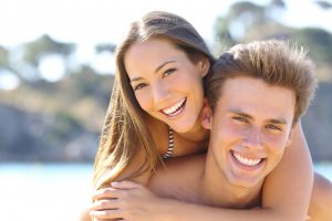 young couple with beautiful smiles