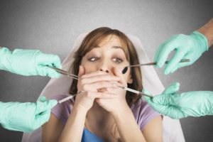 woman scared of dental tools 