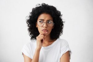 Woman wondering if getting a dental crown will hurt